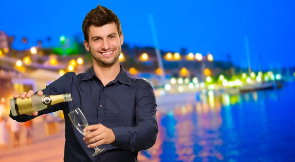 Young Man Pouring Champagne   — Stock Photo, Image